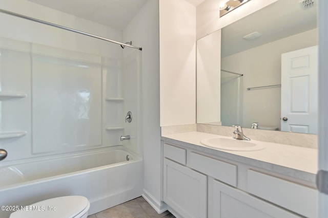 full bathroom featuring tile patterned floors, vanity, toilet, and tub / shower combination