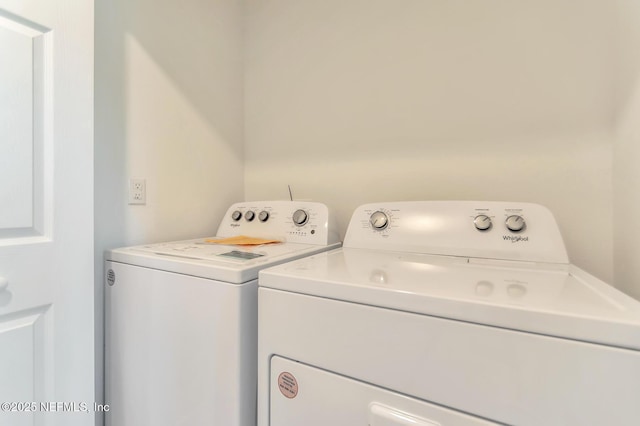 clothes washing area featuring washing machine and dryer