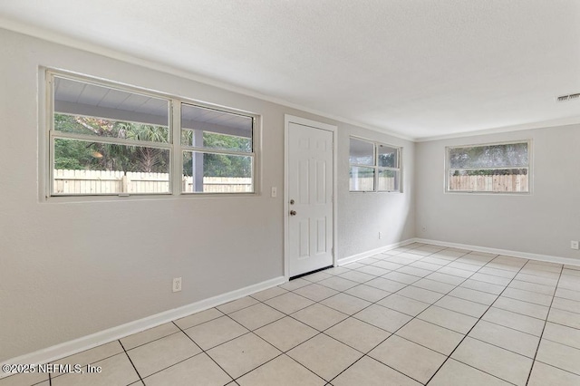 tiled empty room with crown molding