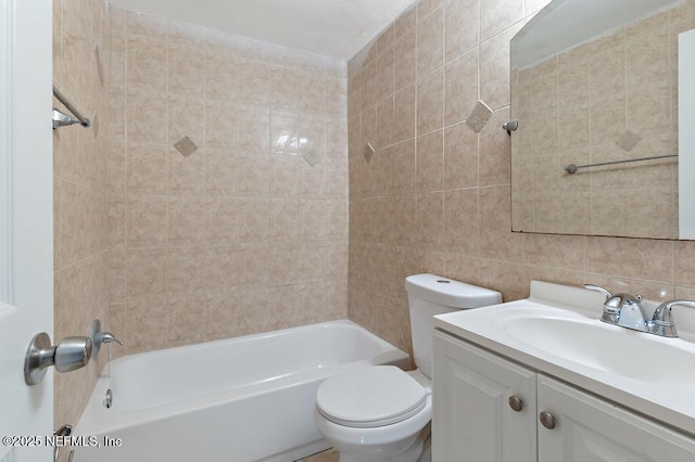 full bathroom featuring vanity, tiled shower / bath combo, toilet, tile walls, and tasteful backsplash