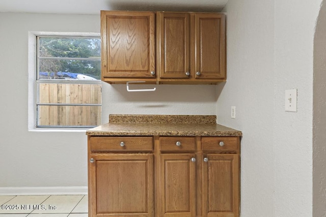 kitchen with light tile patterned flooring