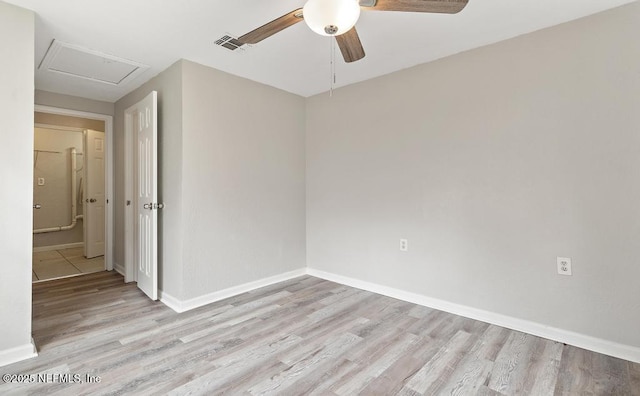 spare room featuring ceiling fan and light wood-type flooring