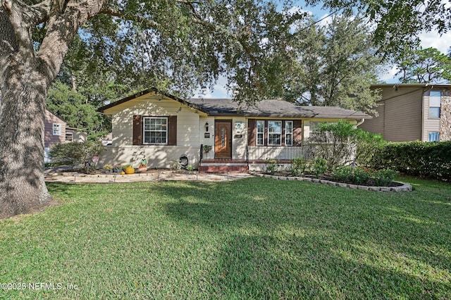 ranch-style home with a front yard