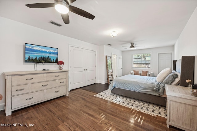 bedroom with ceiling fan and dark wood-type flooring