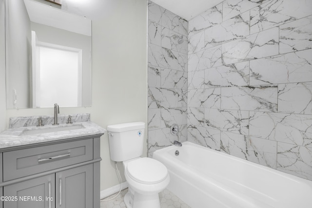 full bathroom with vanity, toilet, and tiled shower / bath combo