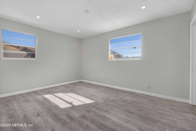 spare room featuring light hardwood / wood-style floors