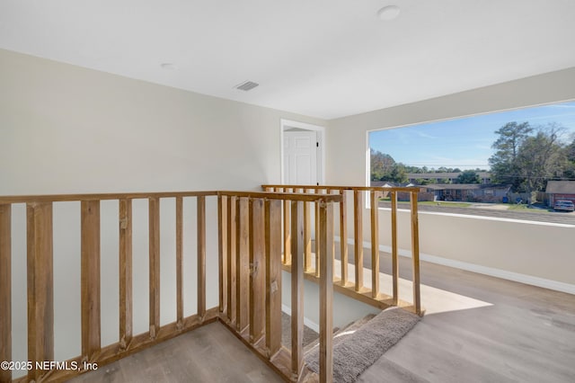 stairs featuring wood-type flooring