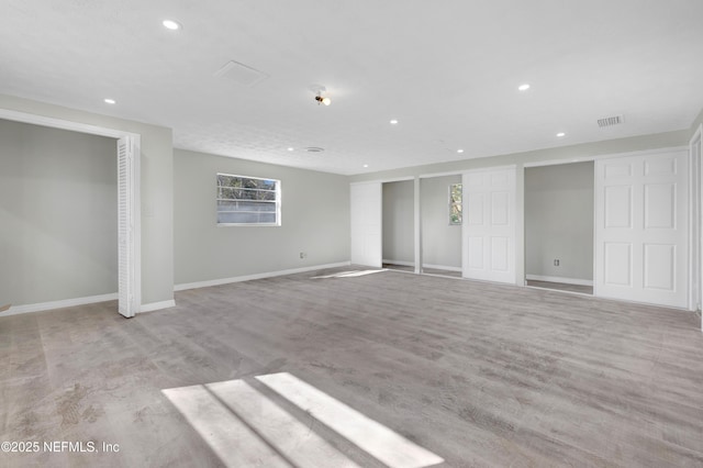 basement with light hardwood / wood-style floors