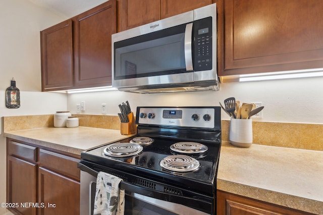 kitchen featuring black range with electric stovetop