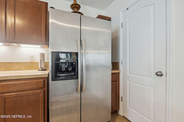 kitchen featuring stainless steel fridge