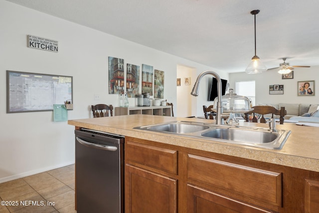 kitchen featuring ceiling fan, sink, pendant lighting, dishwasher, and light tile patterned flooring