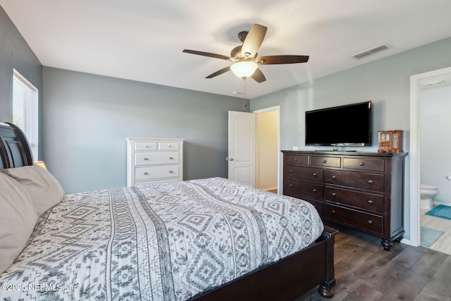 bedroom featuring ensuite bath, ceiling fan, and dark hardwood / wood-style floors