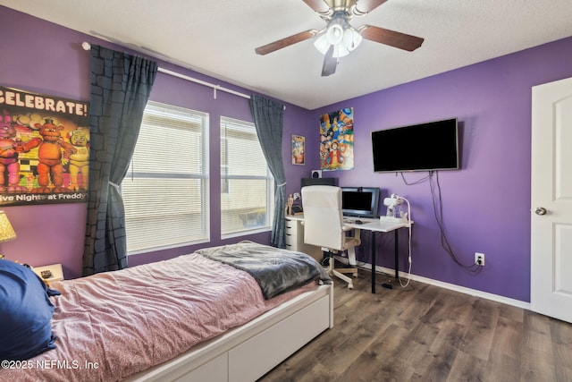 bedroom featuring a textured ceiling, ceiling fan, and dark wood-type flooring