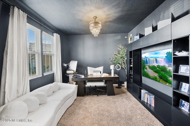 carpeted office space with a chandelier and a textured ceiling