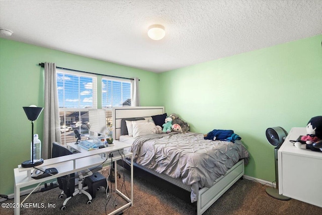 carpeted bedroom with a textured ceiling