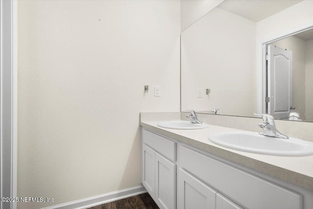 bathroom featuring hardwood / wood-style flooring and vanity