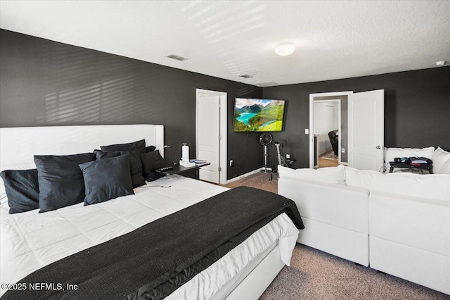 bedroom with carpet flooring and a textured ceiling