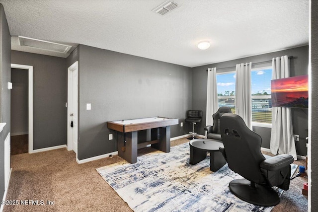 office featuring carpet flooring and a textured ceiling