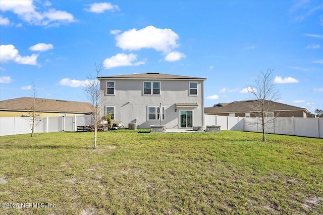 back of house with a yard, cooling unit, and a patio area