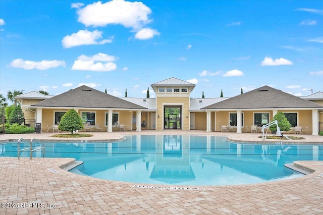 view of swimming pool with a patio