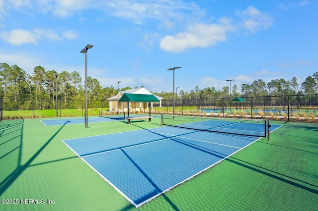 view of sport court featuring basketball hoop