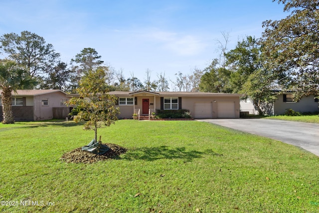 ranch-style house featuring a garage and a front yard