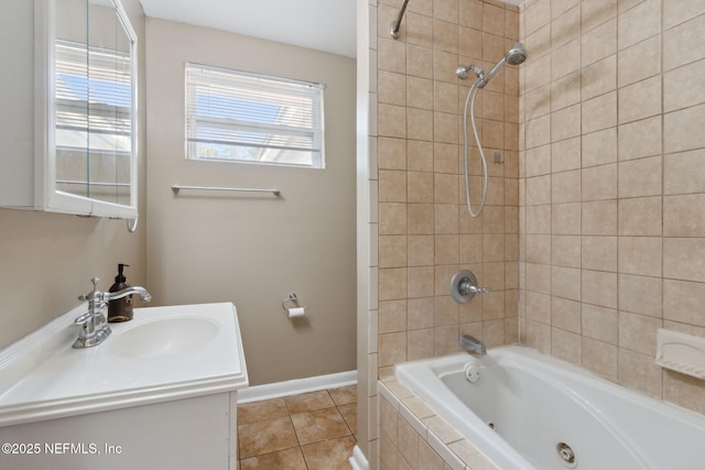 bathroom with tile patterned floors, vanity, and tiled shower / bath