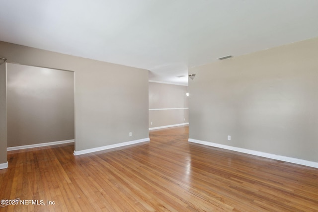 spare room featuring light hardwood / wood-style floors