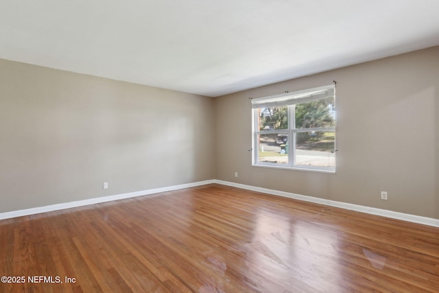 unfurnished room featuring wood-type flooring