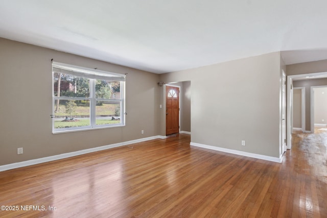 spare room with light hardwood / wood-style flooring