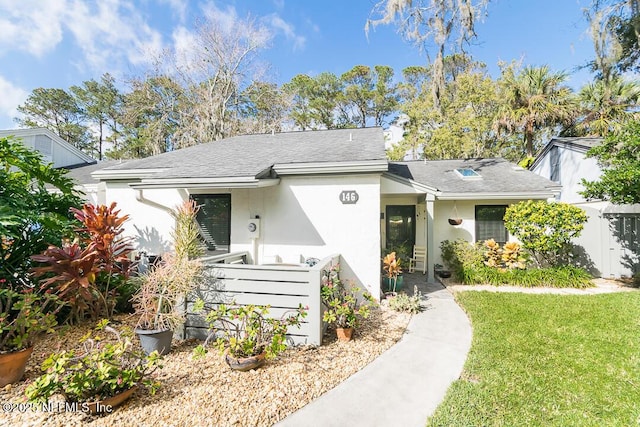 ranch-style house with a front lawn