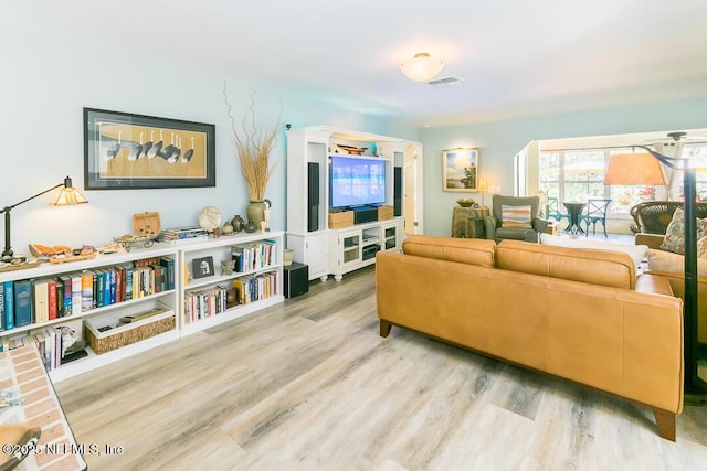 living room with light hardwood / wood-style flooring