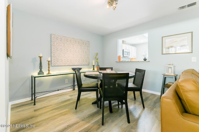 dining area featuring light hardwood / wood-style flooring