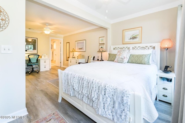 bedroom with hardwood / wood-style flooring, ceiling fan, ornamental molding, and ensuite bathroom