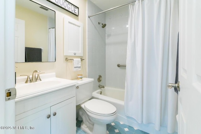 full bathroom featuring tile patterned floors, vanity, toilet, and shower / tub combo