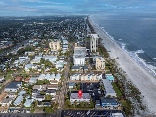 bird's eye view featuring a water view and a view of the beach