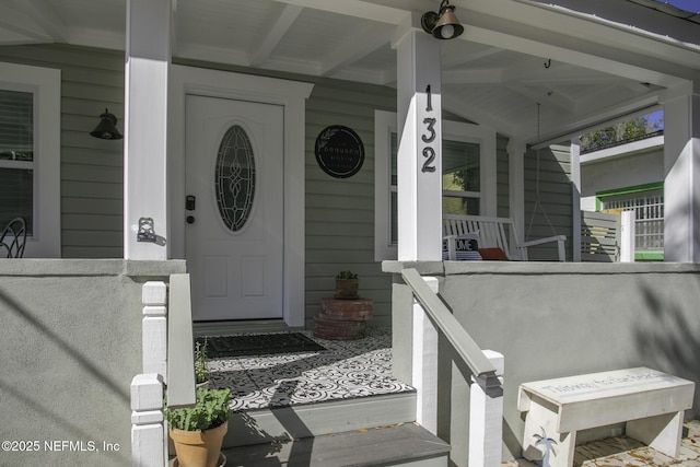 entrance to property with covered porch