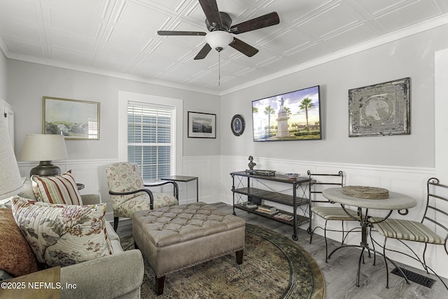 living room with ceiling fan and hardwood / wood-style floors