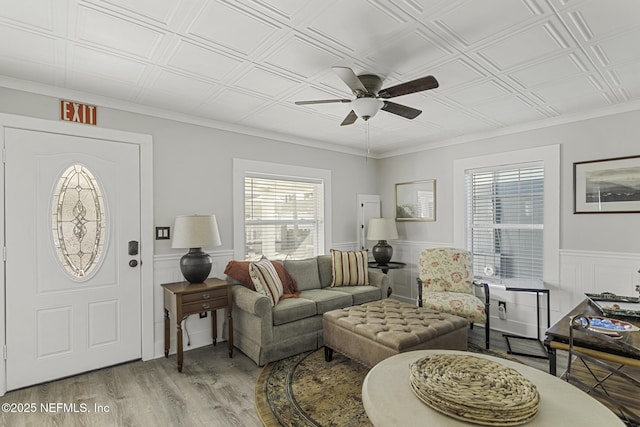 living room featuring ceiling fan and light hardwood / wood-style flooring