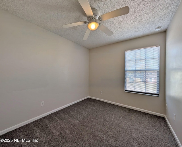 unfurnished room featuring ceiling fan, carpet, and a textured ceiling