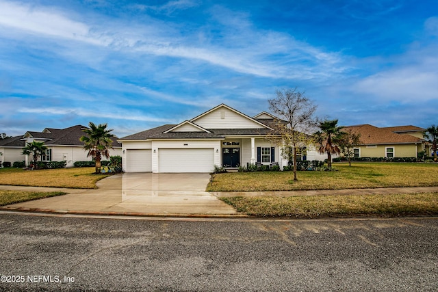 95220 Snapdragon Dr, Fernandina Beach, FL 32034 - ranch-style home featuring a front yard, concrete driveway, and an attached garage
