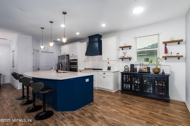 95220 Snapdragon Dr, Fernandina Beach, FL 32034 - kitchen featuring appliances with stainless steel finishes, open shelves, premium range hood, and white cabinets