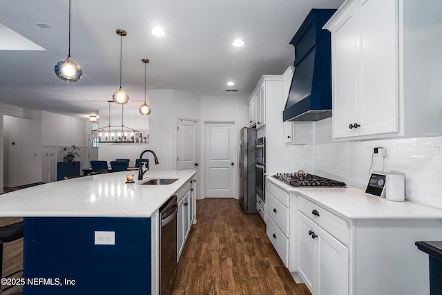 95220 Snapdragon Dr, Fernandina Beach, FL 32034 - kitchen with custom range hood, a sink, appliances with stainless steel finishes, dark wood-style flooring, and backsplash
