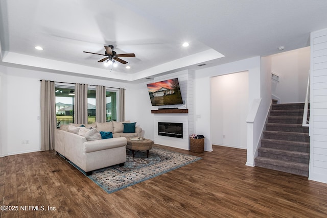 95220 Snapdragon Dr, Fernandina Beach, FL 32034 - living room featuring wood finished floors, a raised ceiling, recessed lighting, and a ceiling fan