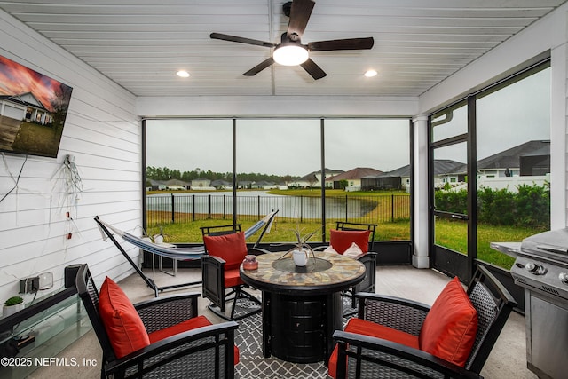 95220 Snapdragon Dr, Fernandina Beach, FL 32034 - sunroom with ceiling fan, outdoor dining area, and a water view