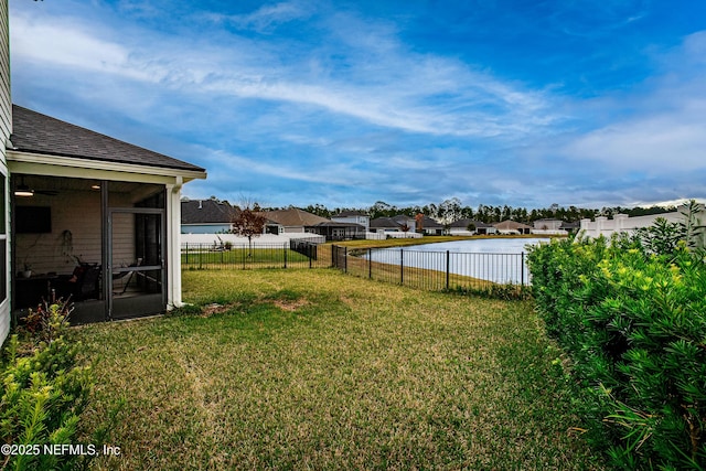 95220 Snapdragon Dr, Fernandina Beach, FL 32034 - view of yard with a sunroom, a residential view, and a fenced backyard