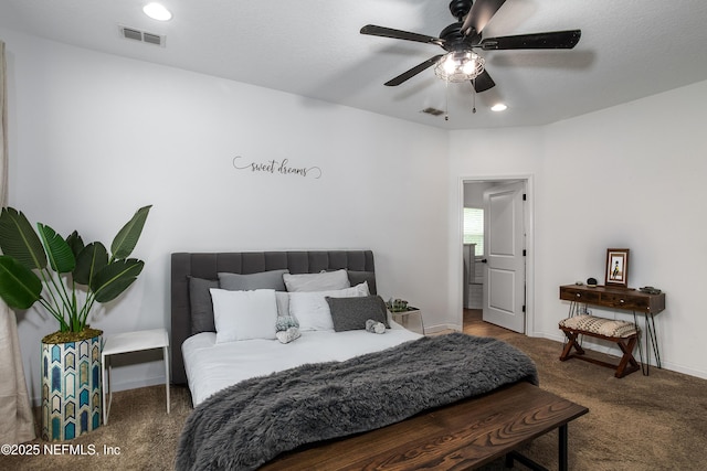 95220 Snapdragon Dr, Fernandina Beach, FL 32034 - carpeted bedroom featuring baseboards, visible vents, and a ceiling fan