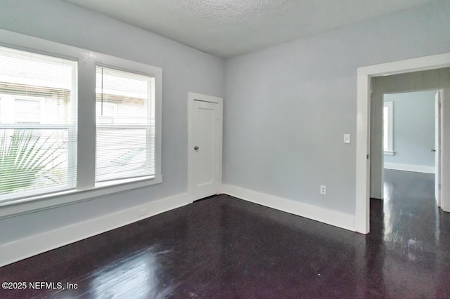 empty room featuring a textured ceiling