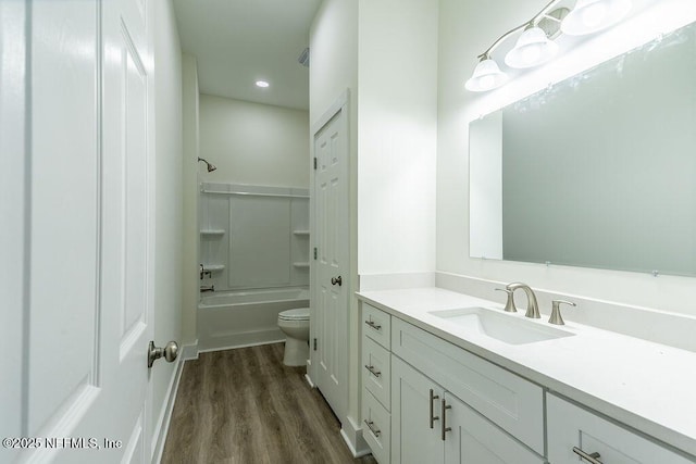 full bathroom featuring shower / bathing tub combination, vanity, toilet, and wood-type flooring