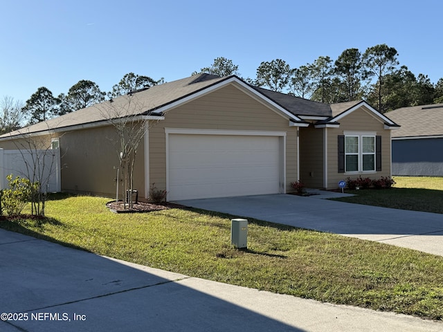 ranch-style home featuring a garage and a front yard